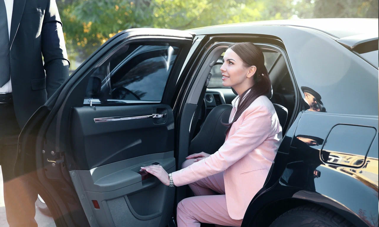 Luxury chauffeur vehicle waiting at Dubai airport terminal